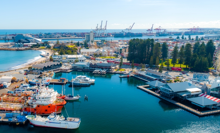 Aerial view of Fremantle Fishing Boat Harbour with cranes in background