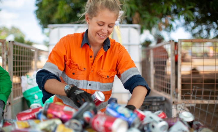 Woman sorting cans for Containers for Change 
