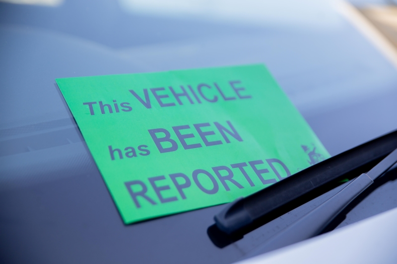 Vehicle has been reported sign on car 