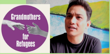 A man in a black shirt sits in front of a colorful mural. Next to him is a purple circle with the text Grandmothers for Refugees and an image of two hands reaching toward each other.