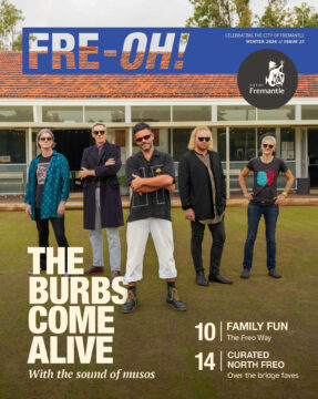 Five people stand in front of a modern house wearing casual and stylish outfits. The magazine cover headline reads, The Burbs Come Alive, with feature articles listed at the bottom right.