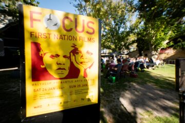 Event poster for the Focus First Nation Films festival at Walyalup Fremantle Arts Centre on January 24th and 25th, viewed from an outdoor audience area.