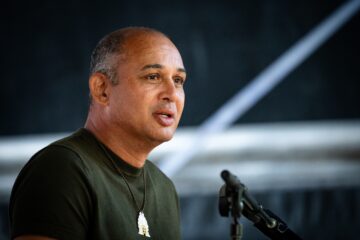 A man speaking into a microphone.